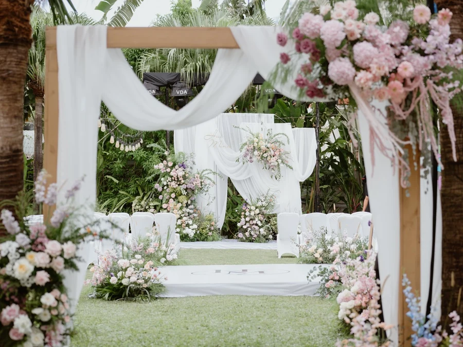 Tropical floral wedding backdrop by DION Event