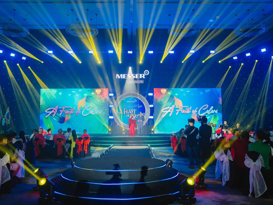 MESSER branded stage with LED visuals and performers