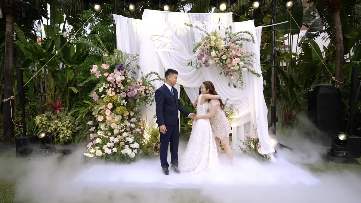 Elegant outdoor wedding decoration with floral backdrop in Vietnam